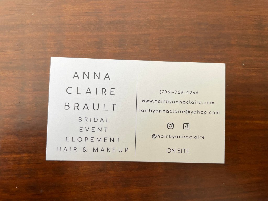 The back of the business card for Hair By Anna Claire