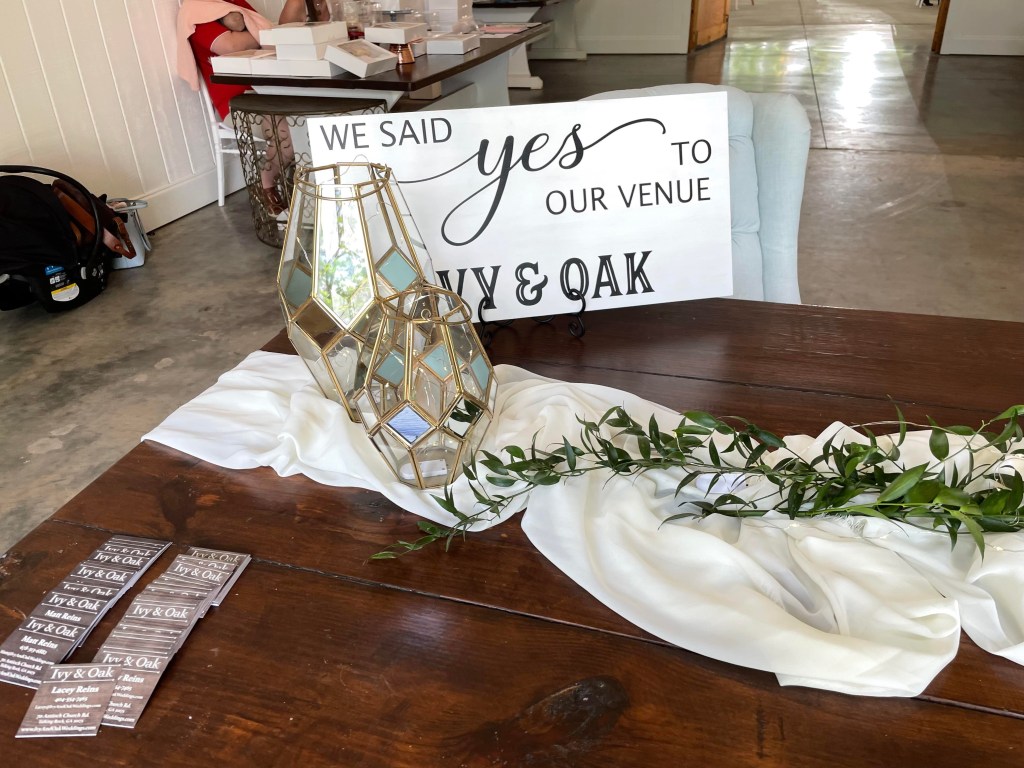 Left side of welcome table inside the wedding barn at Ivy and Oak wedding venue!