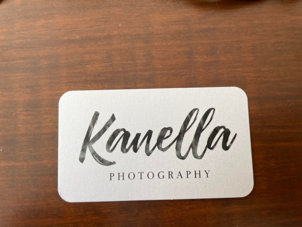 Front of business card for Kanella Photography