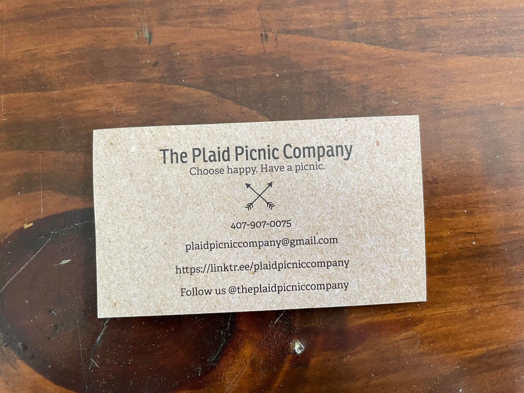 The back of the business card for The Plaid Picnic Company