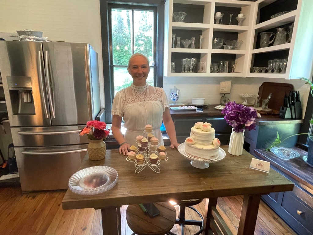 Tabetha with her table at the Ivy and Oak Open House!