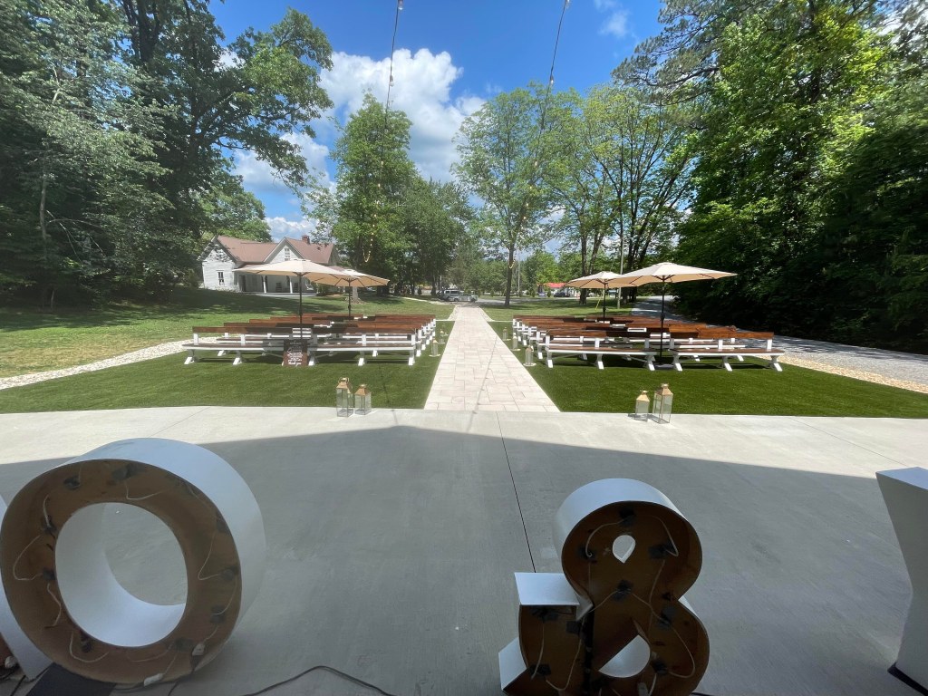 Family and guest seating area in front of the wedding barn at Ivy and Oak wedding venue!