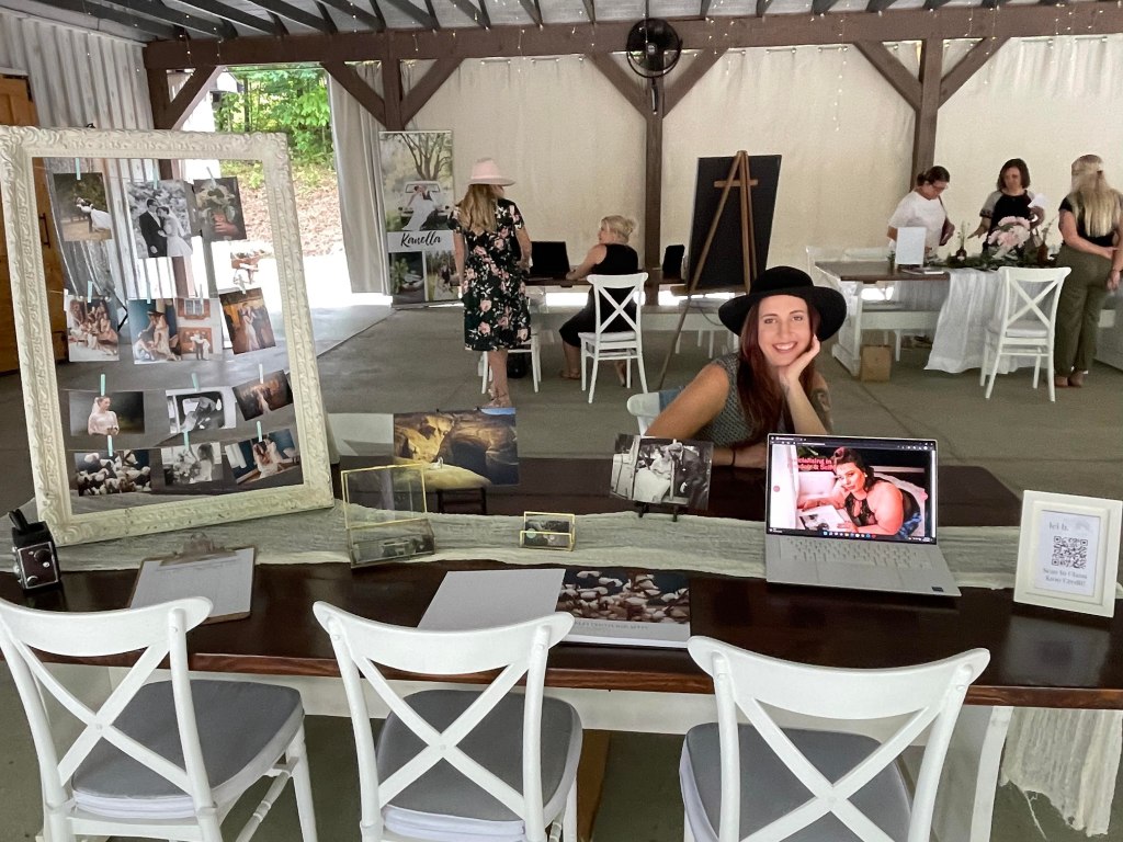 The booth set up for Lei B. Photography along with Lei B. herself!